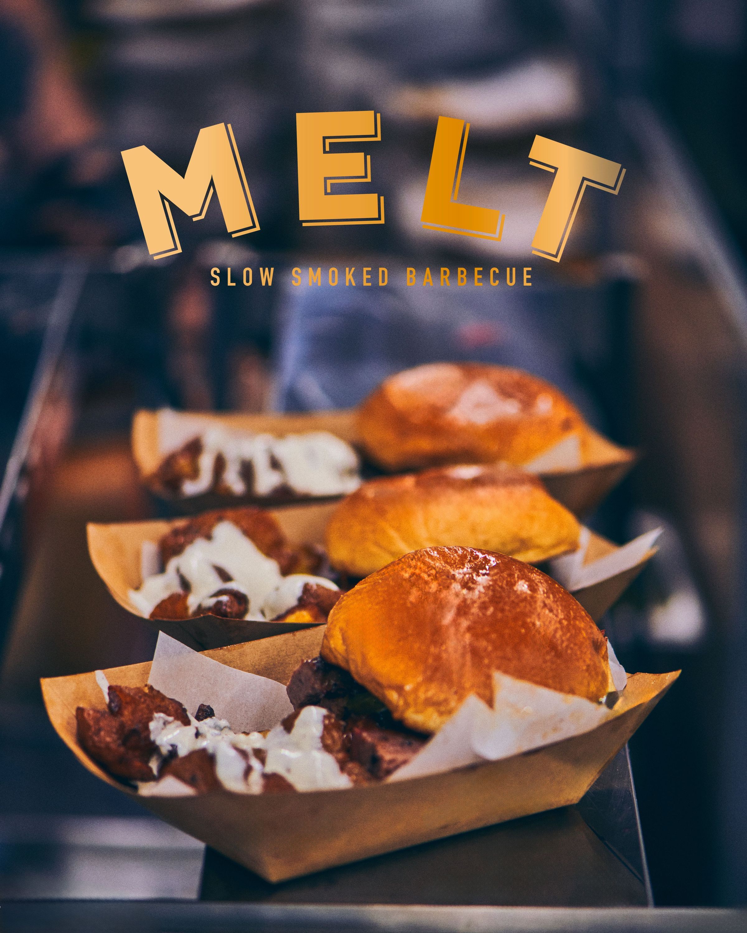 Slow smoked barbecue sandwiches with brisket and pulled pork on a serving tray at MELT restaurant.