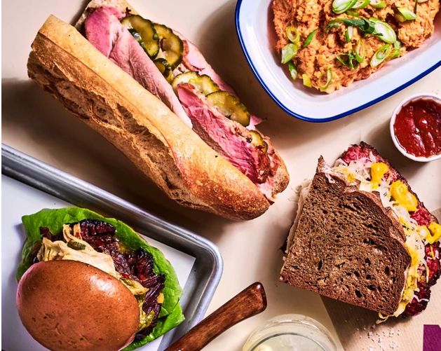 Melted cheese on thick slices of bread, showcasing a delicious grilled sandwich from Melt Deli.